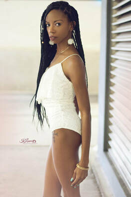 alexcina brown in body suit and braids