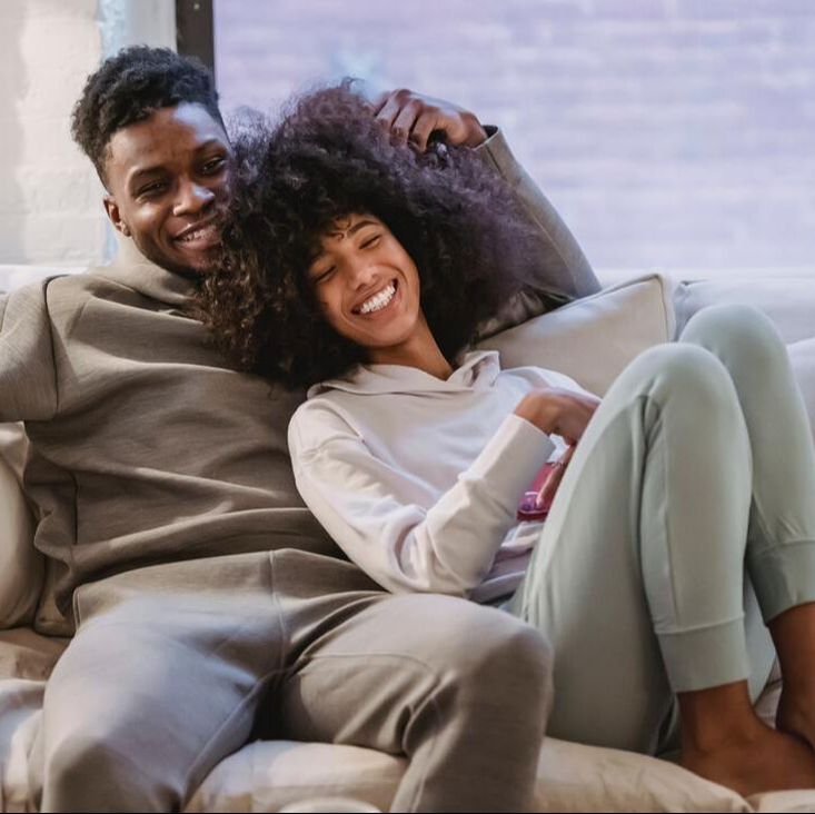couple on the couch, black couple, cuddling