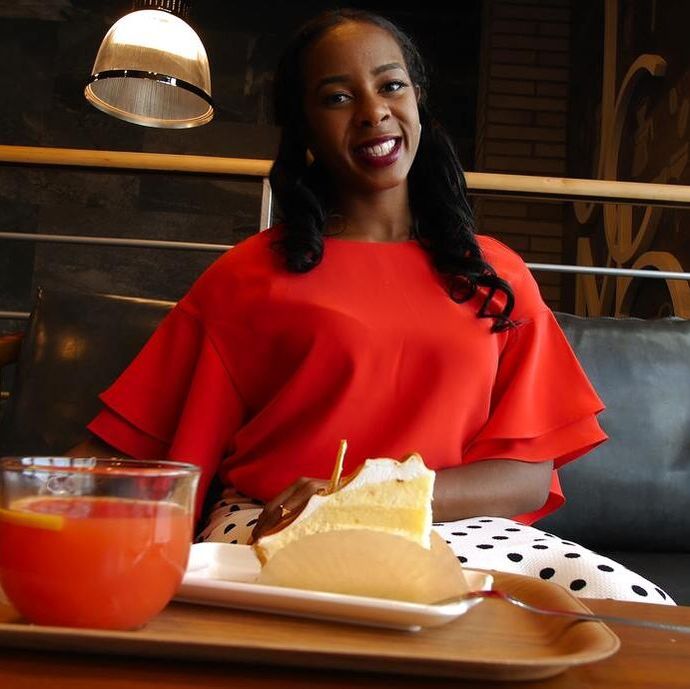 black woman eating out, smiling black woman